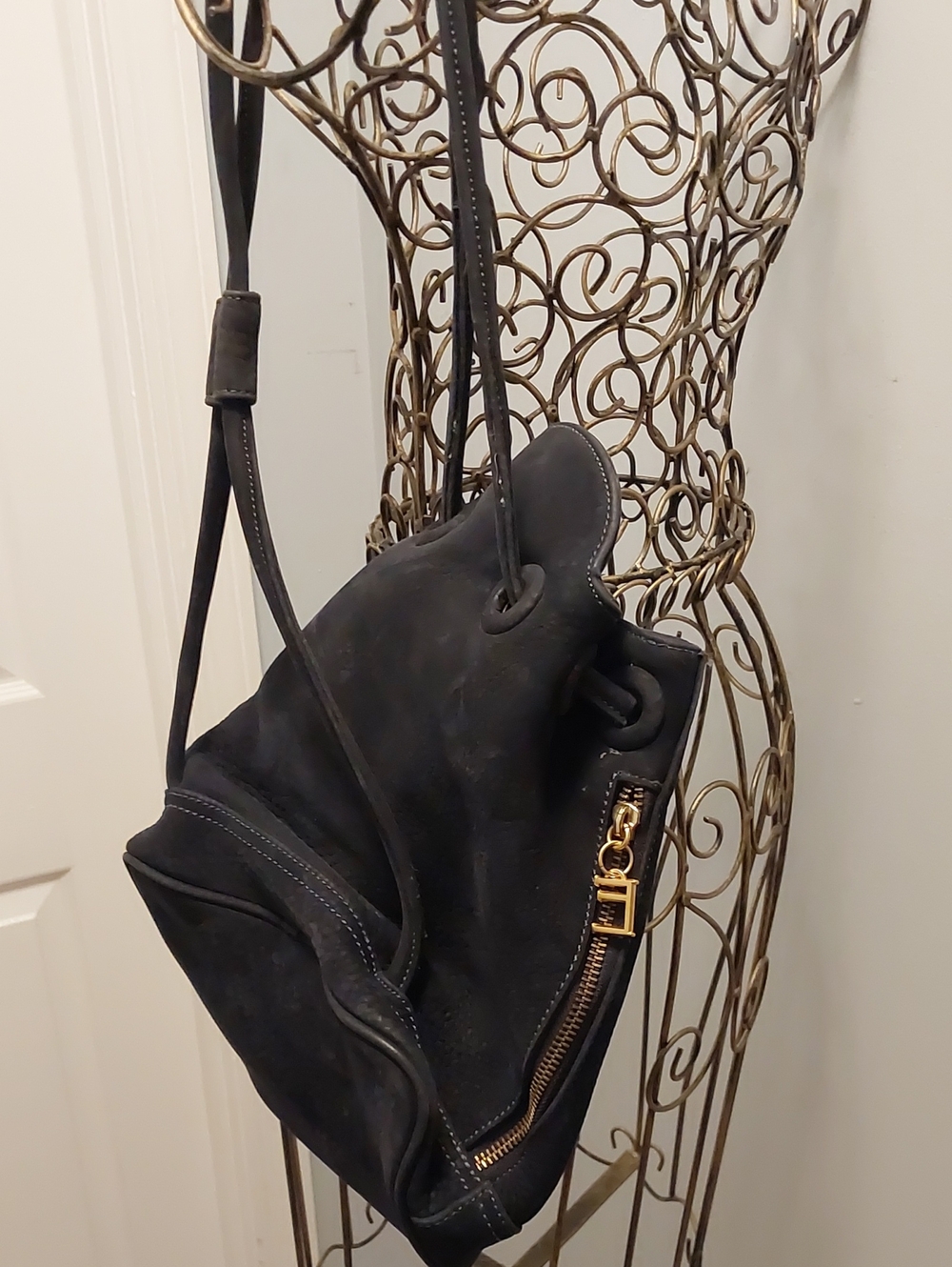 Echo Black Suede Drawstring Shoulder Bag with Gold Hardware